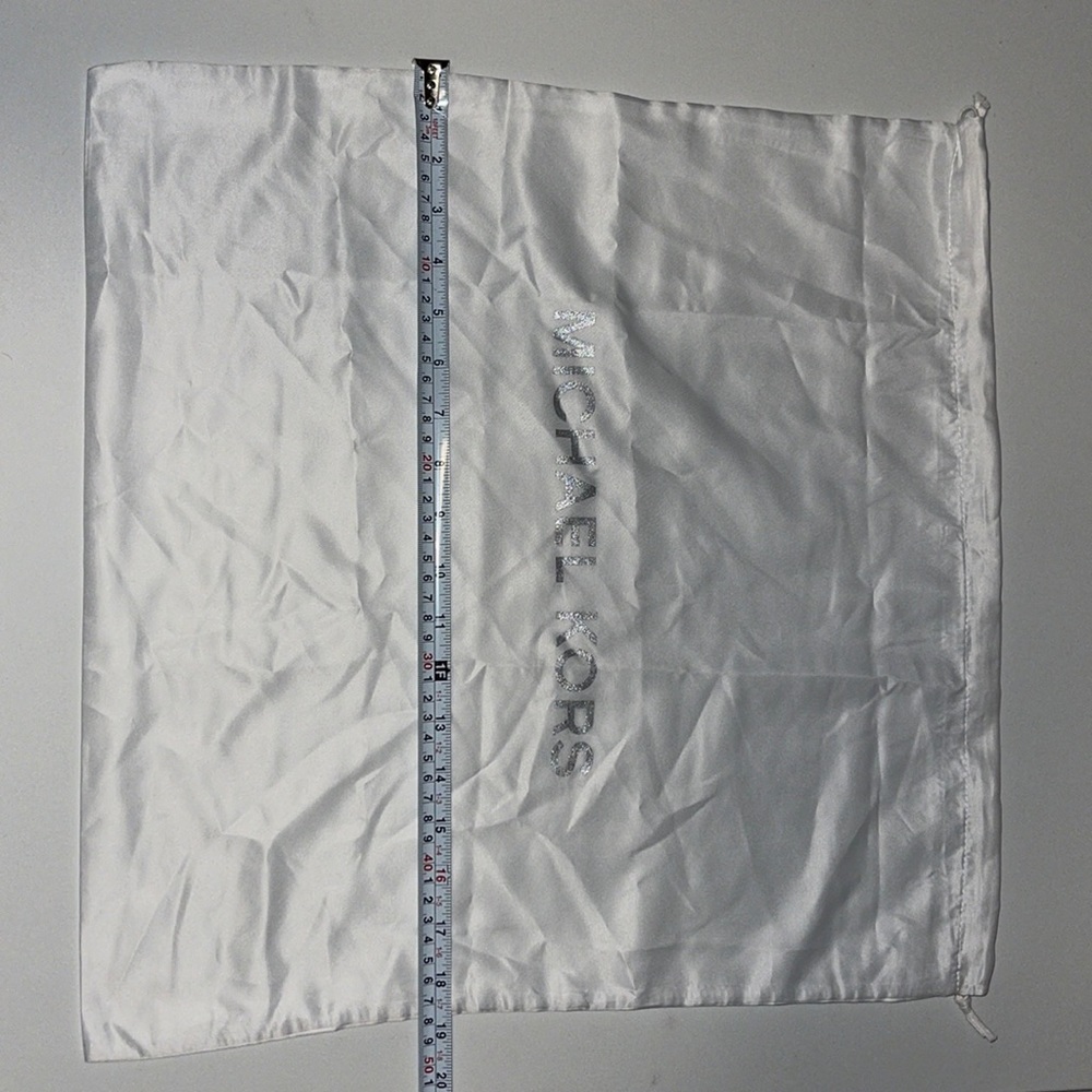 Michael Kors dust bag. White with silver writing.